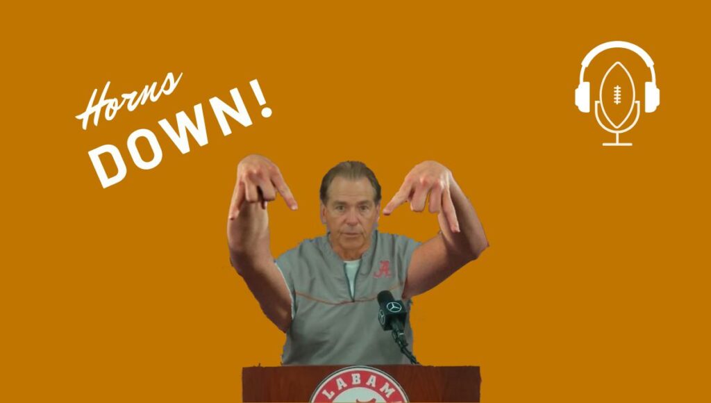 Nick Saban doing the Texas Horns Down gesture